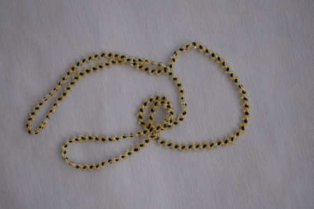 Beautiful beaded necklace. Handmade decoration. Blue and white colors.の写真素材