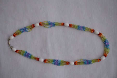 Beautiful beaded necklace. Handmade decoration. Blue and white colors.の写真素材