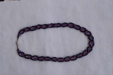 Beautiful beaded necklace. Handmade decoration. Blue and white colors.の写真素材