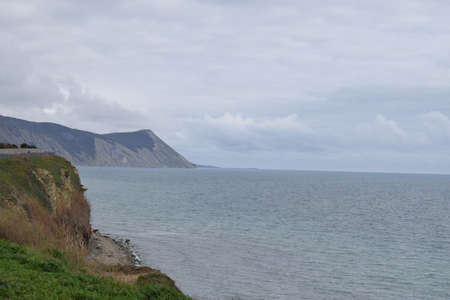 View of the Black Sea, beach and mountains. The resort town of Anapa. Russia. Photo taken in spring.の写真素材