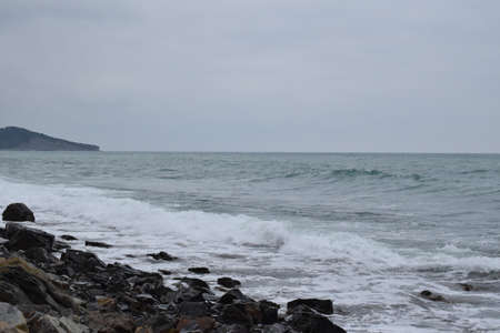 Types of the Black Sea. The outskirts of Anapa. Mountains and rocks, pebble beach, storm. Photo taken in spring.の写真素材