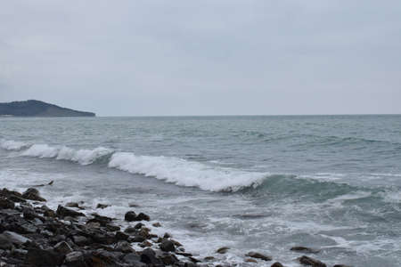 Types of the Black Sea. The outskirts of Anapa. Mountains and rocks, pebble beach, storm. Photo taken in spring.の写真素材