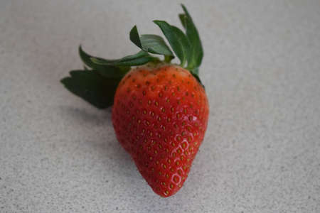 Red strawberries with a green handle on a white background. Isolated objects.の写真素材