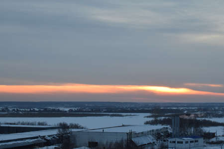 Winter sun at sunset. Cold weather in the evening. Industrial landscape. Natural landscape.の写真素材