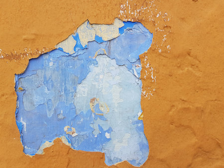 Damaged wall texture. Paint peeling off the wall. Grunge texture background