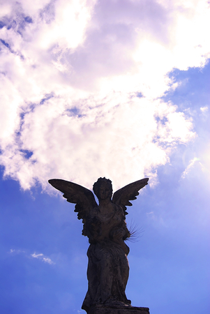 Stone sculpture of Angel announcing abandoned tomb in the cemetery of Xalapa Veracruz, Mexico 2017の写真素材