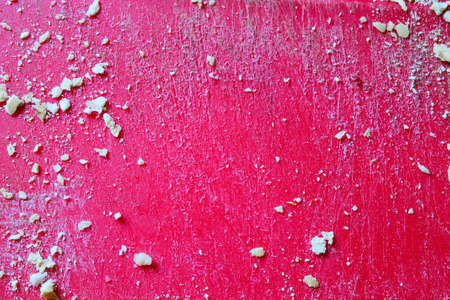 Crumbs  in a Grated Red Surfaceの写真素材