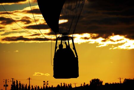 hot air balloon basket in sunsetの写真素材