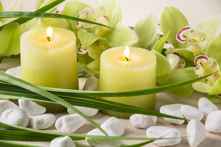 candles, pebble stones and orchidの写真素材