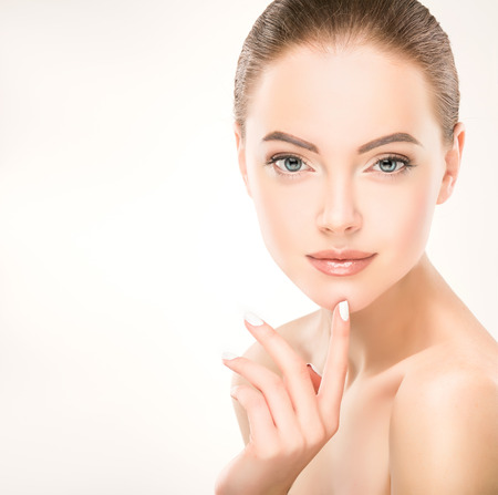 Yong, gorgeous model touch her face and demonstrate freshness and clean womans face skin. Skin care and Cosmetology.の写真素材
