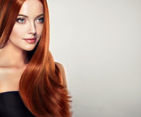 Young, brown haired, woman  with straight and voluminous hair.Exllent wave of hair.の写真素材