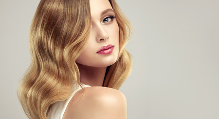 Hair color of straw, middle length hairstyle, soft, almost invisible makeup. Close up beauty portrait of young, gorgeous woman.Cosmetic, cosmetology, hairdressing and makeup.の写真素材