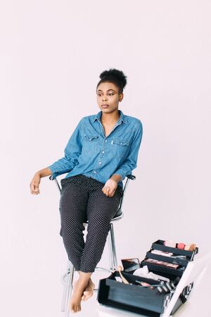 Young beautiful African American woman waiting for make-upの写真素材