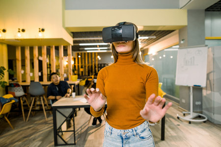 cheerful young woman adjusting her virtual reality headset and excited playing video game in VR...