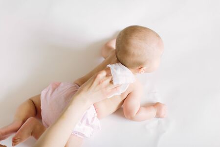 Mother Wiping Baby's back.の写真素材