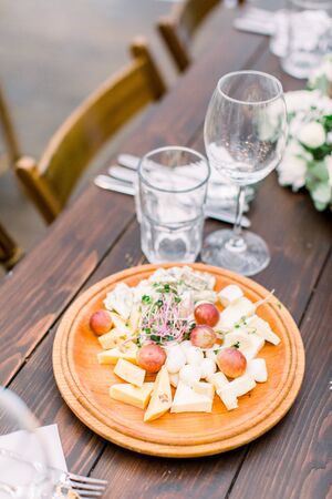 Catering service. Wooden restaurant table with food at event.の写真素材