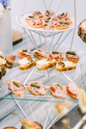 Delicious canapes as event wedding dish. Catering - served table with various snacks, canape and appetizers. Selective focusの写真素材