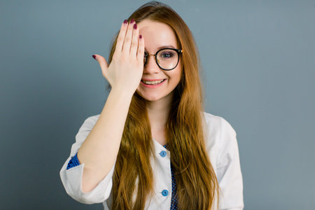 Closeup portrait of friendly, smiling confident female doctor, healthcare professional with labcoat...