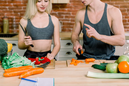 Home. Happy Together. Husband and Wife. Preparing Food. Kitchen. Apartment. Natural. Vegetables....