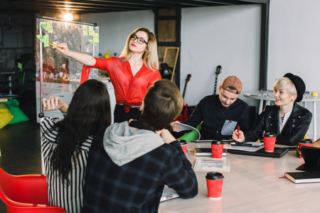 Multiracial young creative people in modern office. Group of young business people are working...