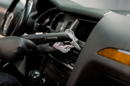 Cleaning of car air duct with hot steam cleaner. Steam heat cleaning, disinfection of vehicles....