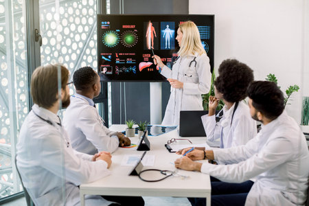 Medical education, health care and medicine concept. Team of multiethnic doctors having meeting in...