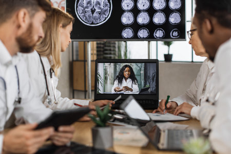 Diverse team of medical scientist having online meeting with african american speaker about brain...