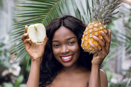 Promo of healthy food, vegan and beauty concept. Young smiling pretty African woman with perfect...