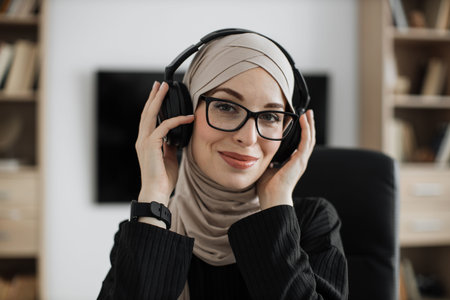 Resting, break after studying and work. Close up portrait of young woman in headphones, choosing...