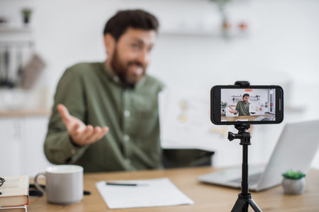 Worried man doing live streaming about economic predictionの写真素材