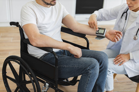 Crop of female doctor and patient with disability having talk about diagnosis.
