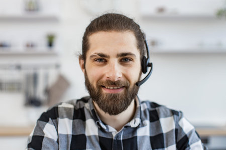 Happy professional working virtually as staff member for fully remote company.