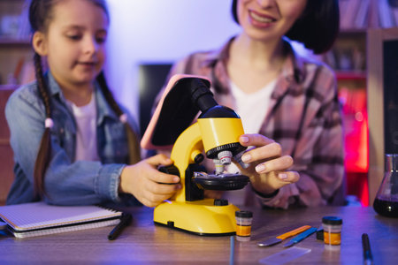 Concept of parenthood and teaching, leisure time in evening at home.