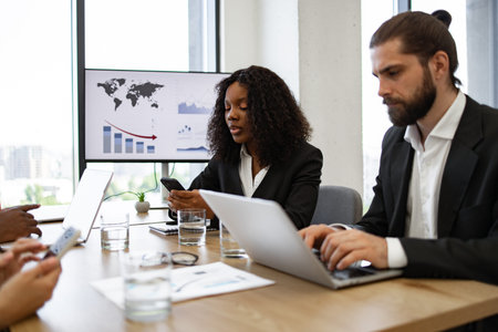 Diverse business team in a meeting with digital devices