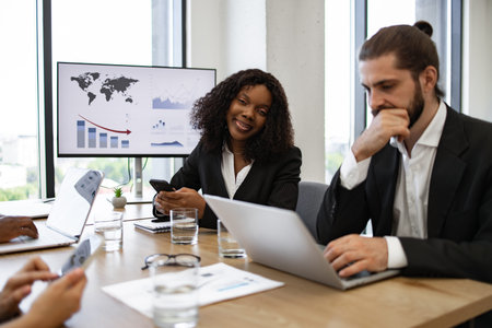 Business meeting with diverse team analyzing financial reports