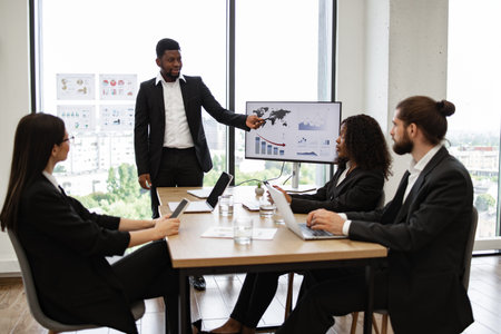 Business team meeting in modern office discussing data and strategy