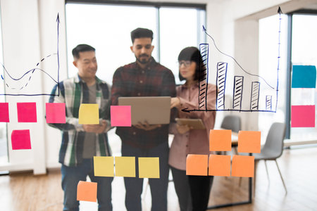 Collaborative business meeting with data analysis and brainstormingの写真素材