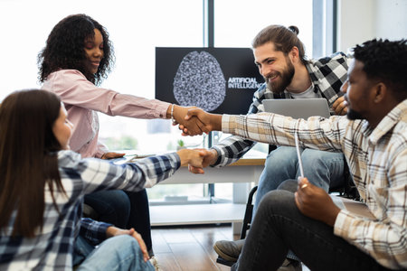 Young professionals collaboratively engage in work on artificial intelligence, promoting teamwork...