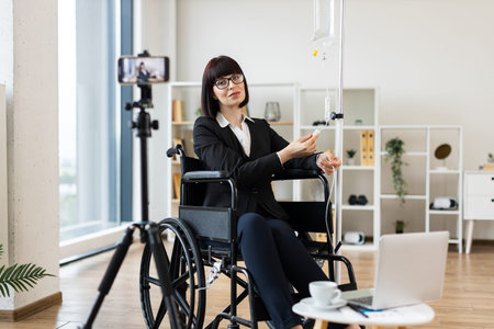 Caucasian woman seated in wheelchair under intravenous therapy shares work-life balance advice on...
