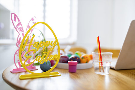 A bright and cheerful scene depicting the preparation for Easter egg decorating with colorful eggs and festive decorationsの写真素材