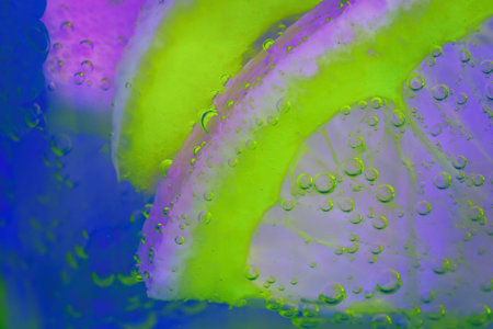 Citruses, lemon, orange in water with air bubblesの写真素材