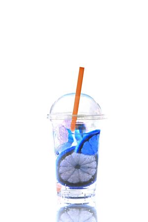 A glass of lemonade abstract color isolated on a black background.の写真素材
