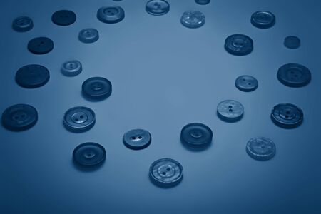 Buttons of different pastel colors in blue tones.の写真素材
