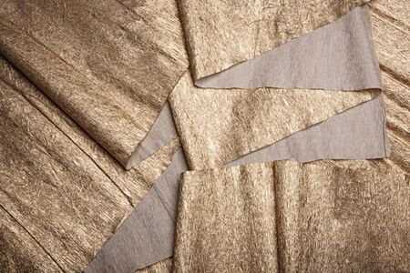 Golden texture. Gold leaf corrugated wrapping paper.の写真素材