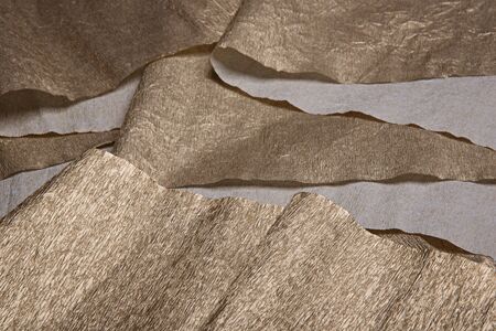 Golden texture. Gold leaf corrugated wrapping paper.の写真素材
