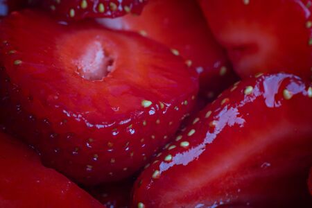 Cut juicy strawberries. Macro photo. Strawberry Background.の写真素材