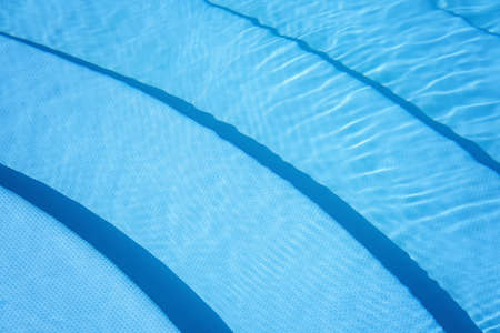 The surface of the water in the blue swimming pool.の写真素材