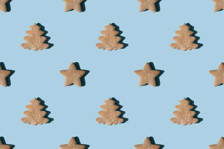 Pattern of gingerbread in the shape of stars and Christmas treesの写真素材