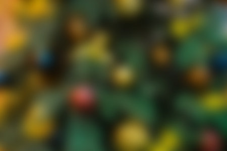 Christmas tree with bright decorations out of focus. Blurred New year background.の写真素材