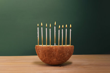 Creative Hanukkah menorah on a wooden table.の写真素材